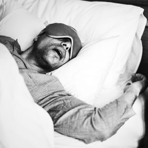 A man sleeping on a bed