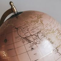 Pink globe sphere in a room